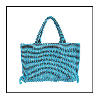 Capriccioli Medium zig zag- The bag is made using authentic Sardinian hand weaving methods in ethically managed factories. This tote bag is extraordinary and evokes faraway cultures with a contemporary touch, with focus on details such as colour, and material that are sustainable and eco-conscious