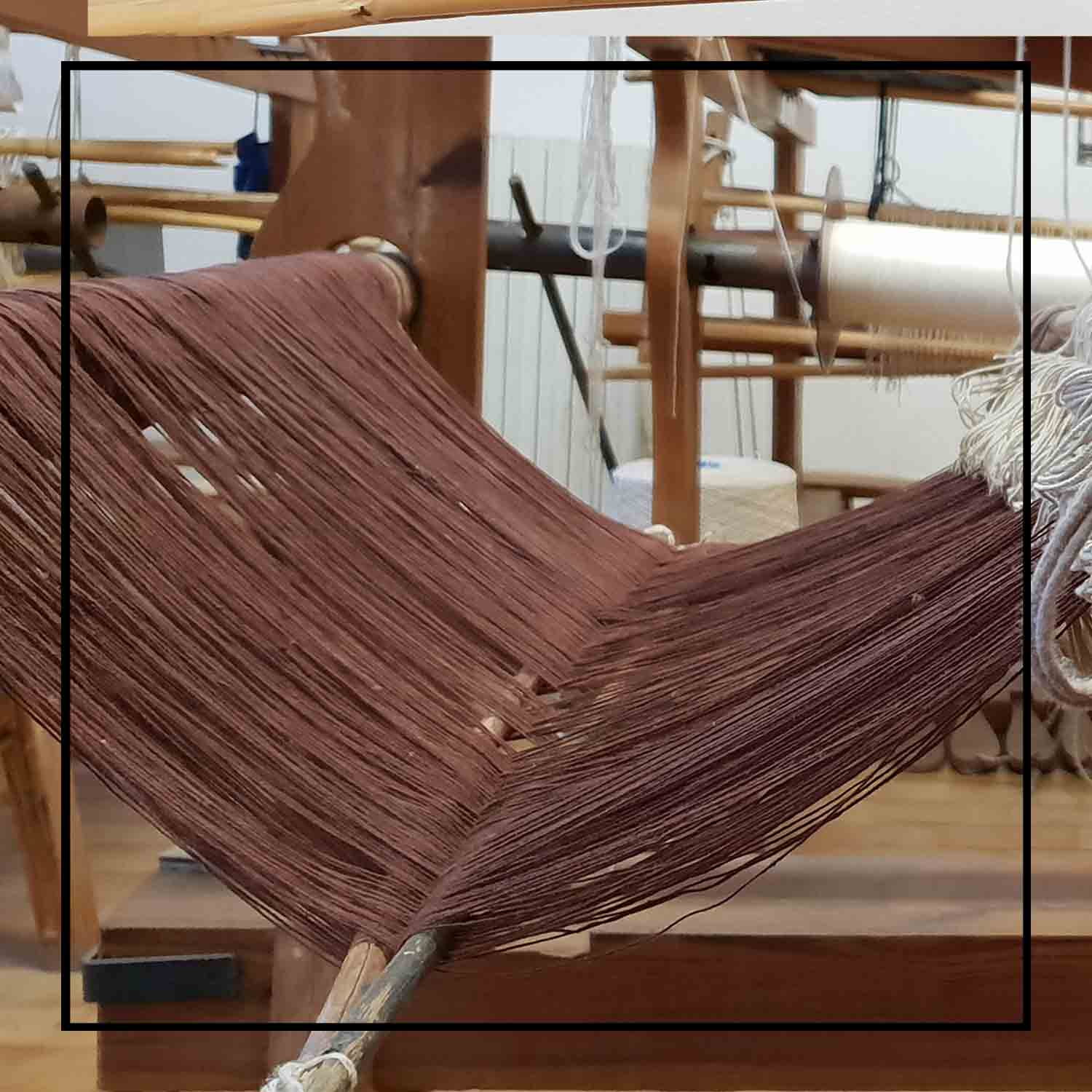 The wooden loom view where the turquoise tote bag is made this is a winter or summer bag - luxury handbag - handwoven tote made in Italy by hand • timeless individualistic fashion • eco-friendly fashion • socially responsible, lasting fashion