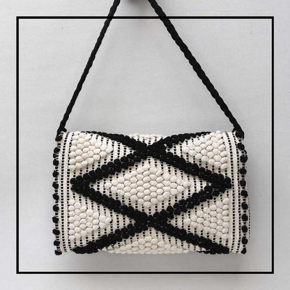 Back View of the Suni Rombi Crossbody Bag by Antonello Tedde – Handwoven Sustainable Cotton Bag in Black and Cream with Rombetti Pattern, Ethical and Timeless Italian Craftsmanship