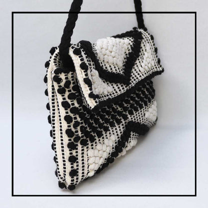 Side view of the Suni Rombi Crossbody Bag by Antonello Tedde – Handwoven Sustainable Cotton Bag in Black and Cream with Rombetti Pattern, Ethical and Timeless Italian Craftsmanship