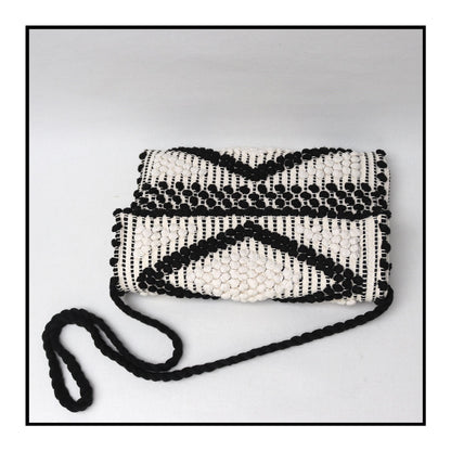 View from above of the Suni Rombi Crossbody Bag by Antonello Tedde – Handwoven Sustainable Cotton Bag in Black and Cream with Rombetti Pattern, Ethical and Timeless Italian Craftsmanship