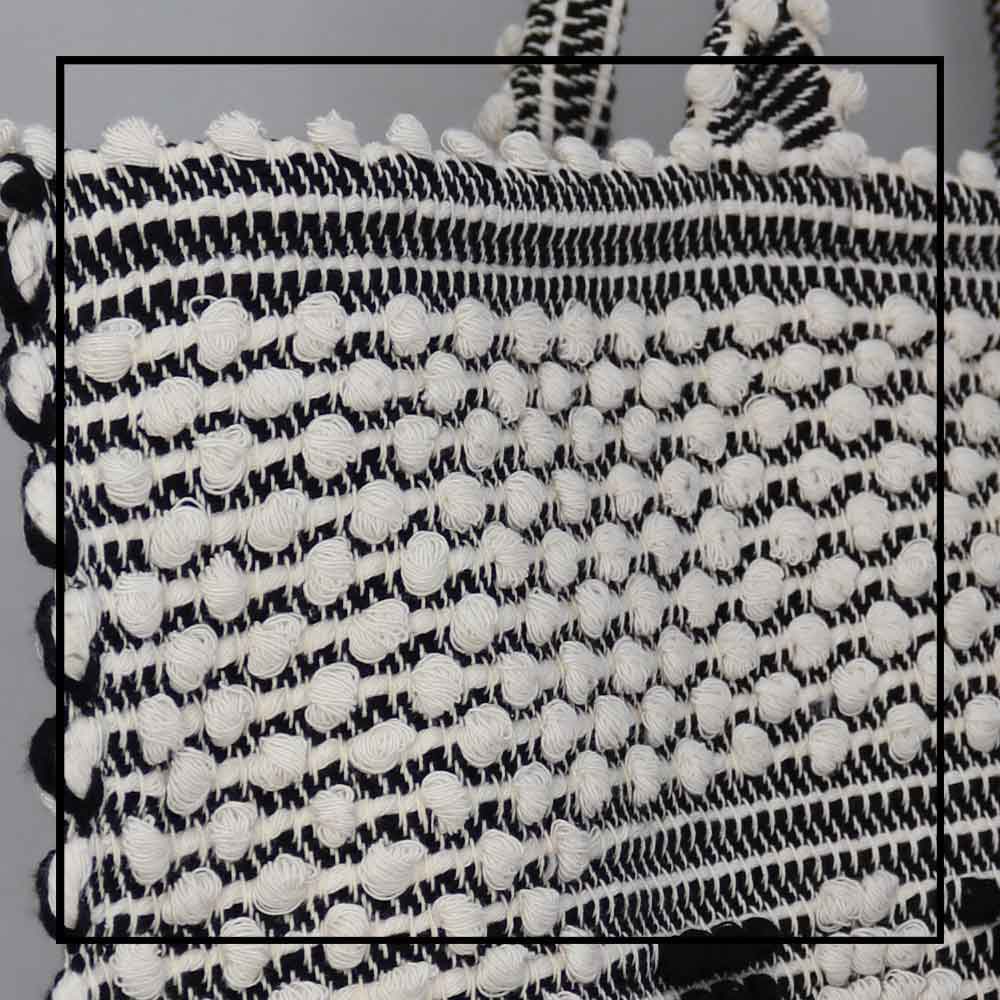 Poms detail view - Sustainable tote - summer bag - luxury handbag - handwoven black and white tote made in Italy by hand • timeless individualistic fashion • eco-friendly fashion • socially responsible, lasting fashion, 